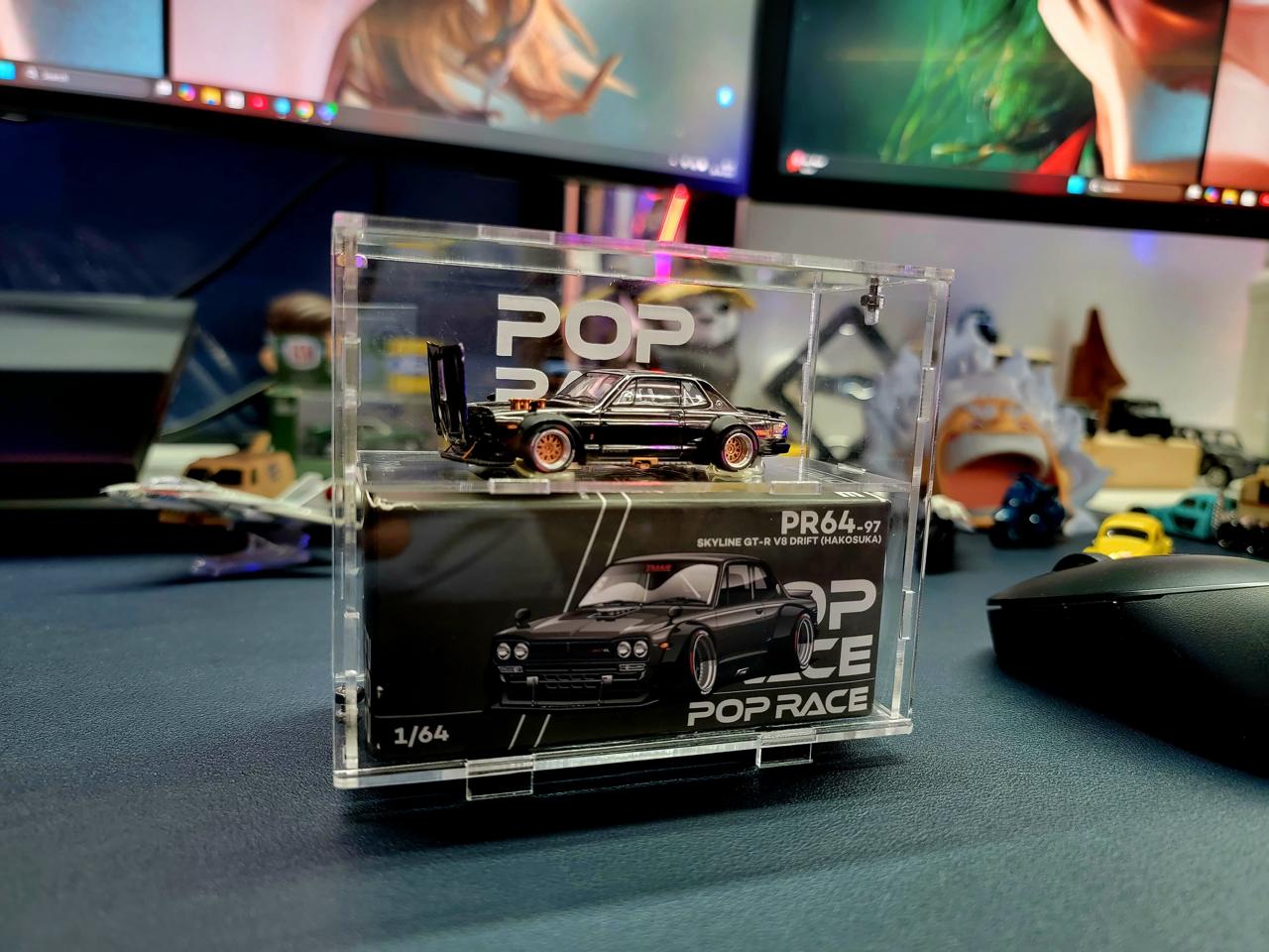Pop Race Skyline GT-R displayed in a double-decker acrylic case